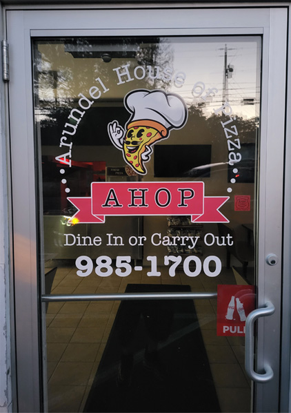 Arundel House of Pizza entrance with AHOP logo on the door