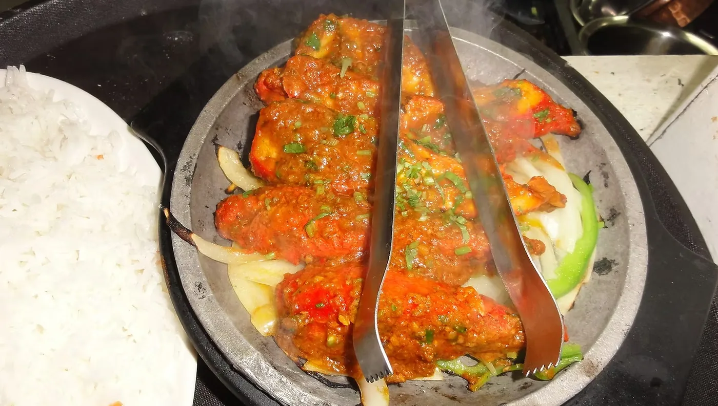 Sizzling tandoori platter served with rice