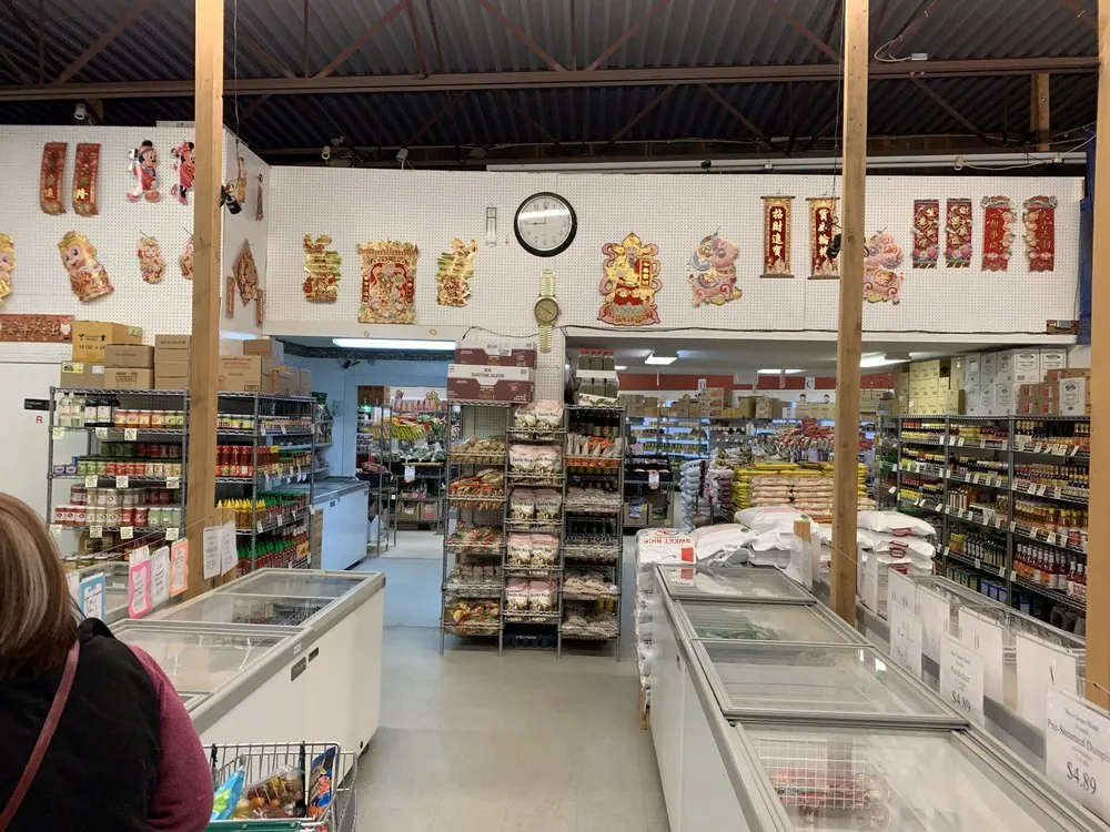 Interior view of Tran's Market with pantry shelves and freezers